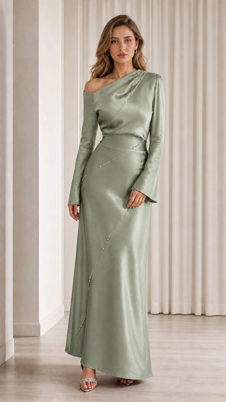 Front view of model wearing sage green one-shoulder satin gown
