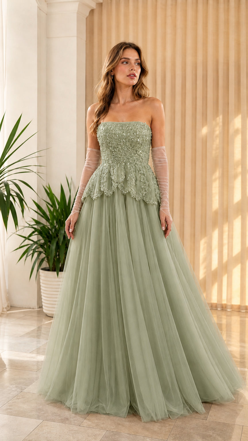 Full-length front view of sage green strapless beaded peplum tulle formal dress