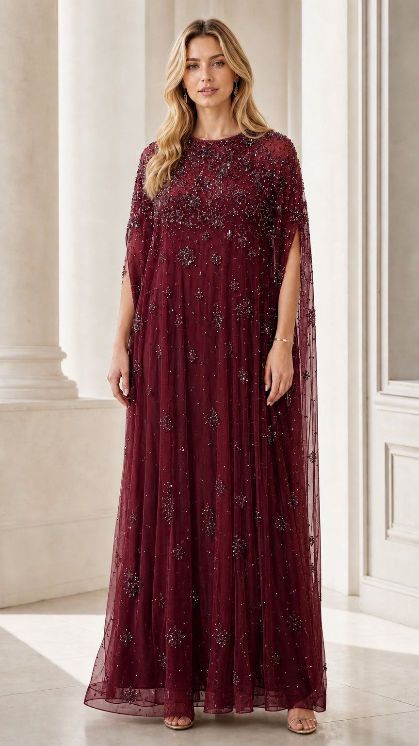 Front view of burgundy beaded mesh cape maxi dress