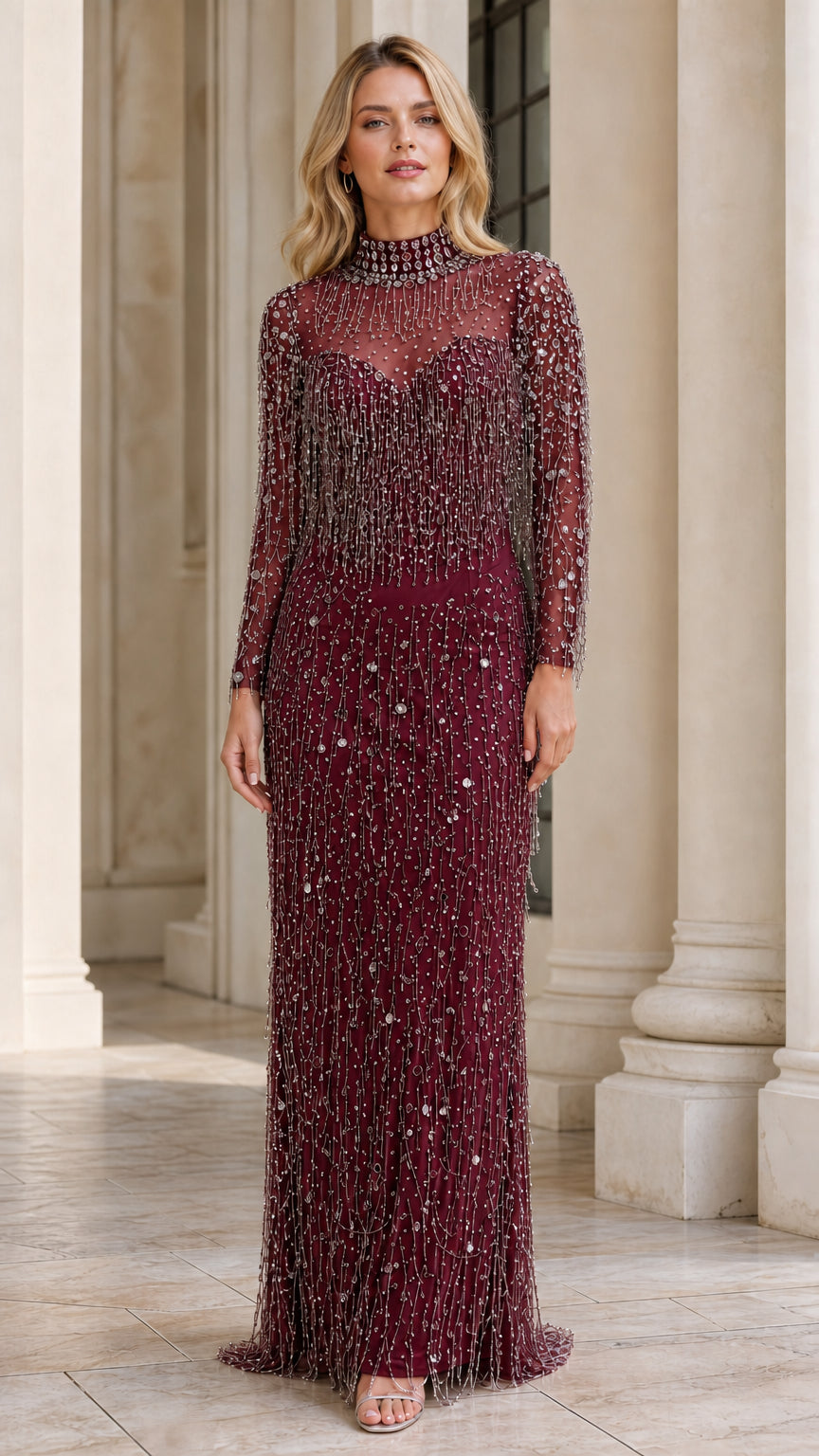 Model wearing burgundy beaded long sleeve evening gown