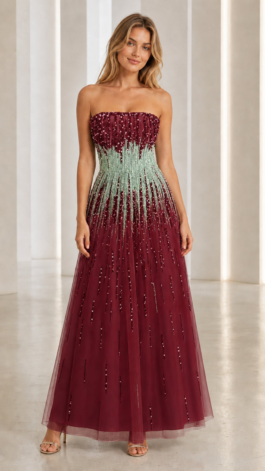 Model wearing burgundy sequin strapless evening gown