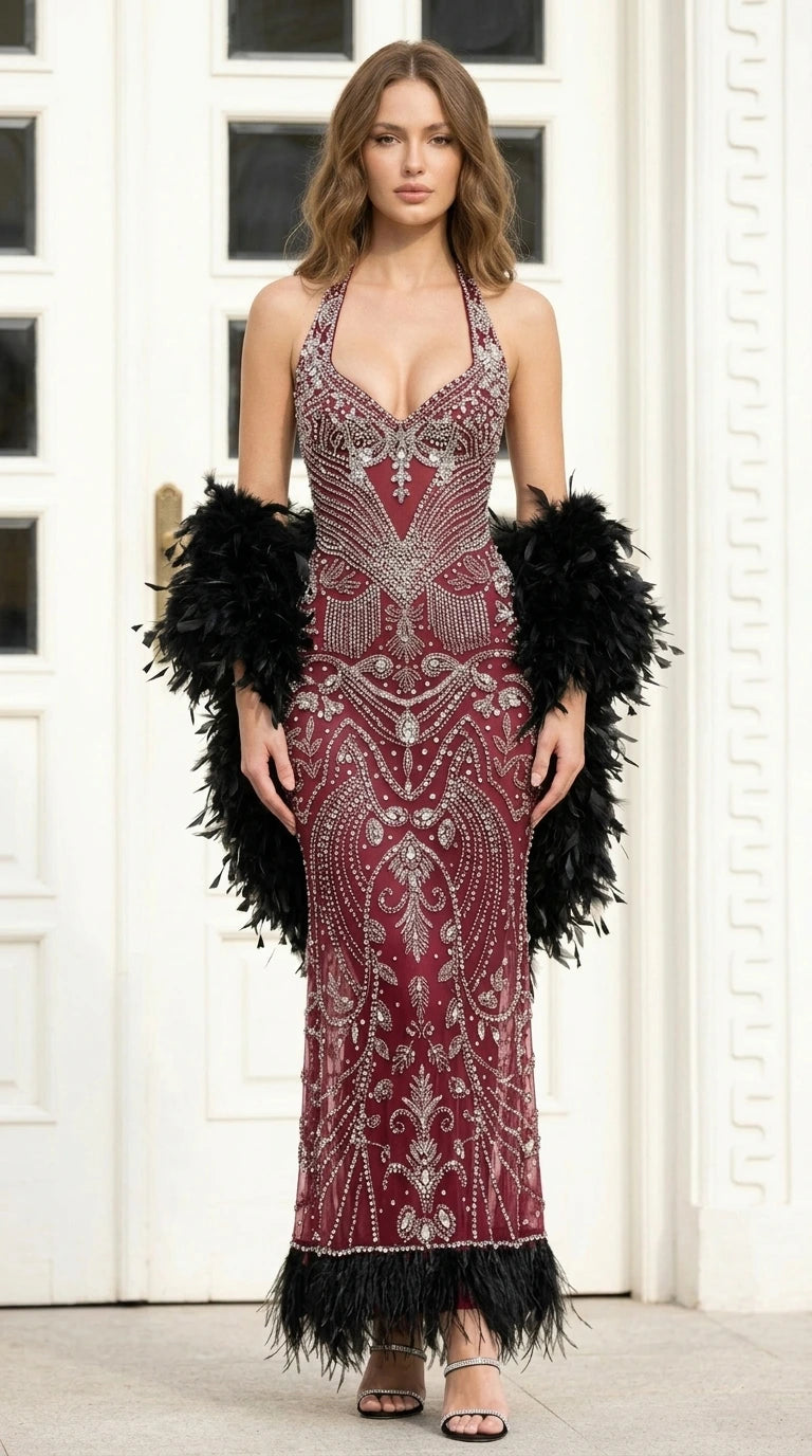 Front view of Burgundy beaded evening gown with feathered hem