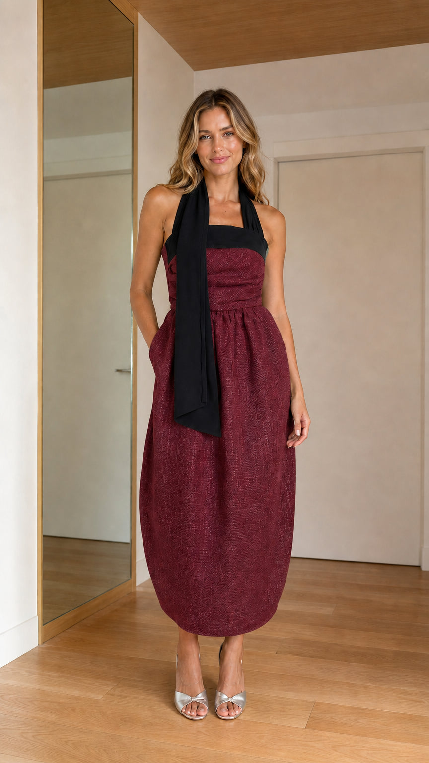 Front view of woman wearing burgundy wine contrast halter tie cocoon midi dress