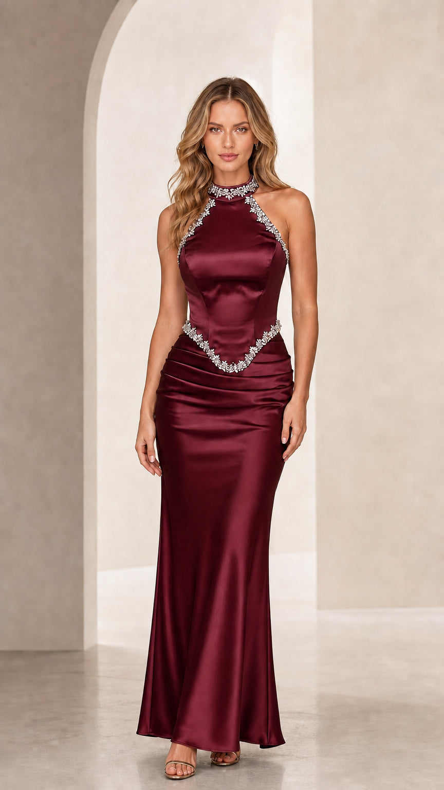 Front view of burgundy red satin halter neck evening gown with rhinestone trim