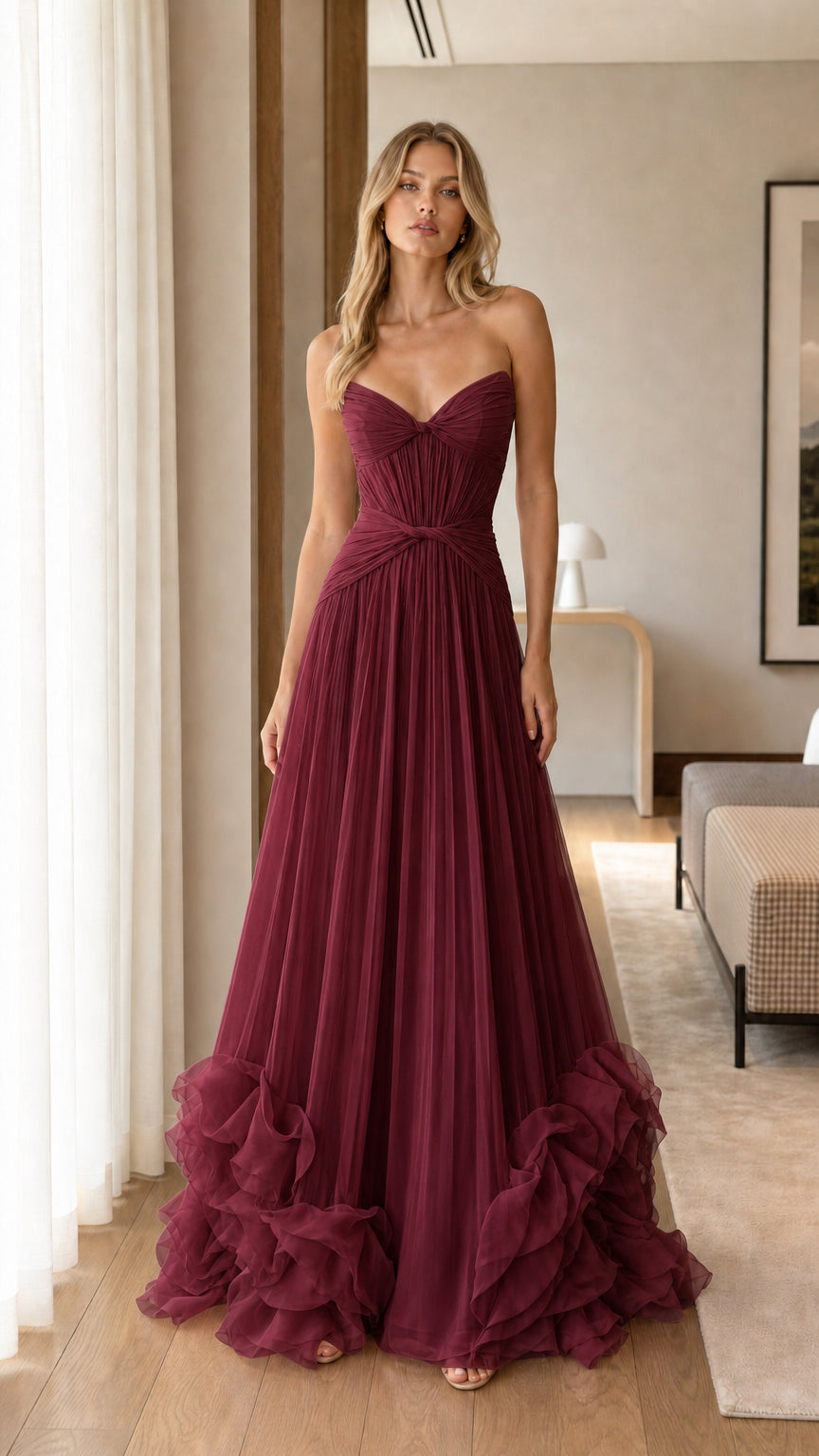Model wearing Burgundy red strapless sweetheart pleated tulle gown