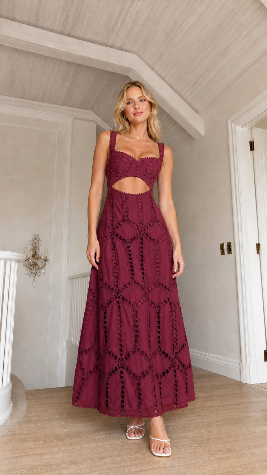 Front view of model wearing burgundy cutout eyelet maxi dress