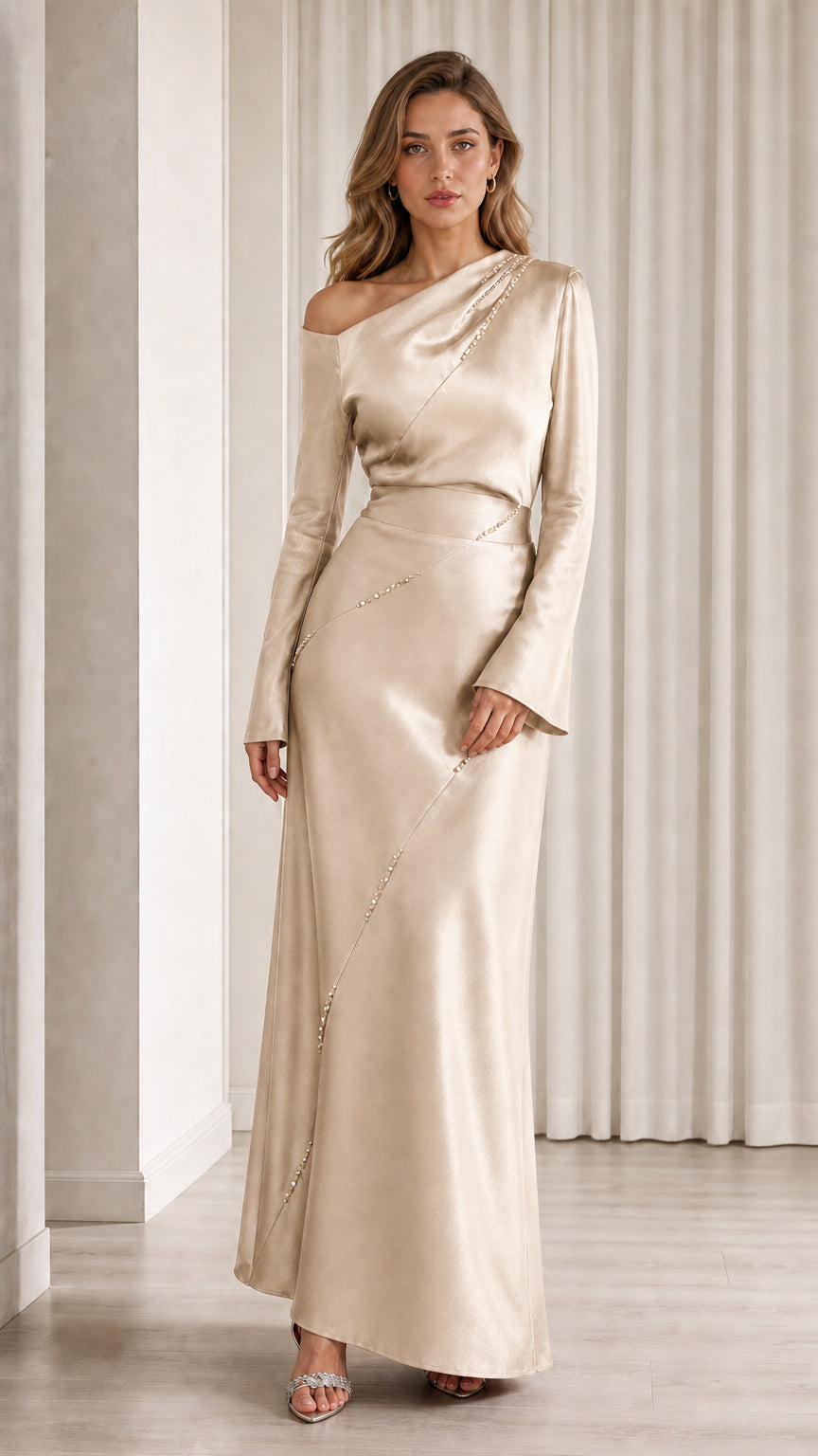 Front view of model wearing champagne one-shoulder satin gown