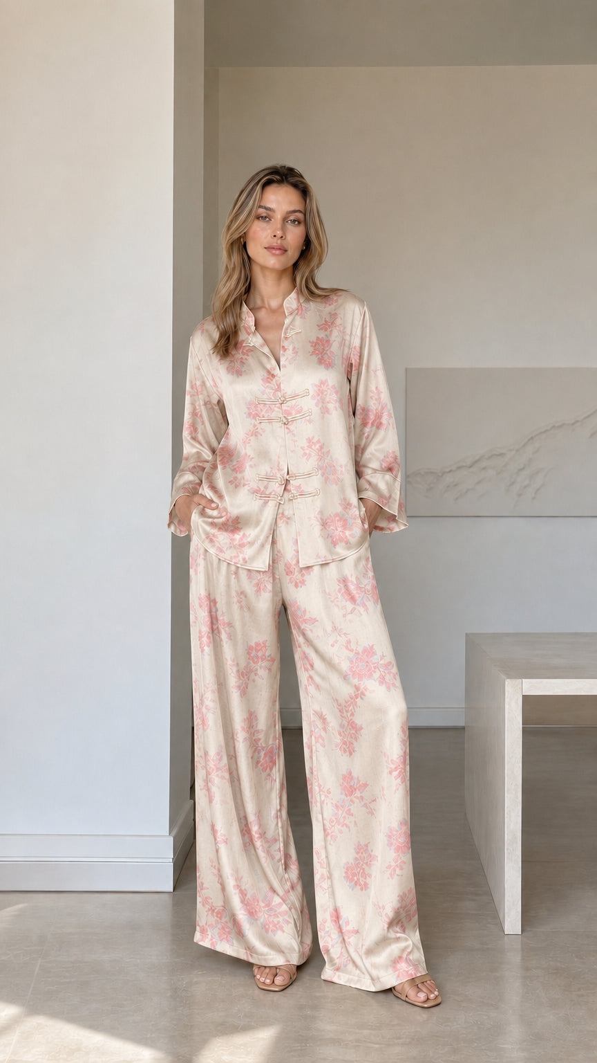 Model wearing champagne ivory floral satin pajama set