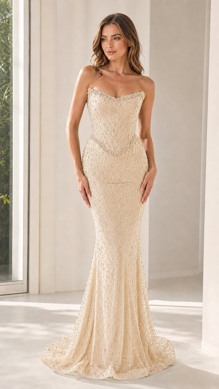 Front view of champagne strapless beaded mermaid evening gown