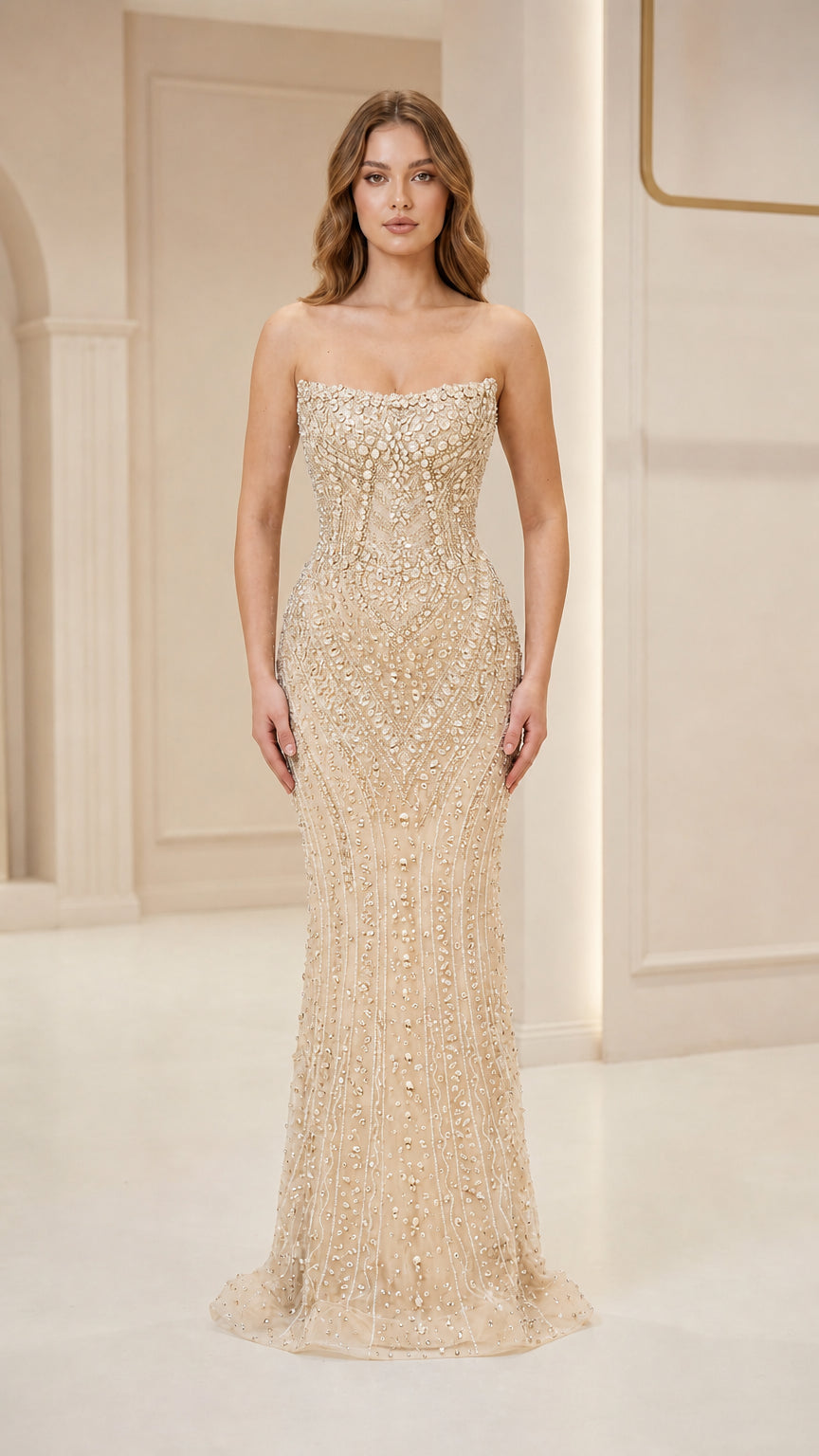 Front view of woman wearing champagne strapless beaded evening gown