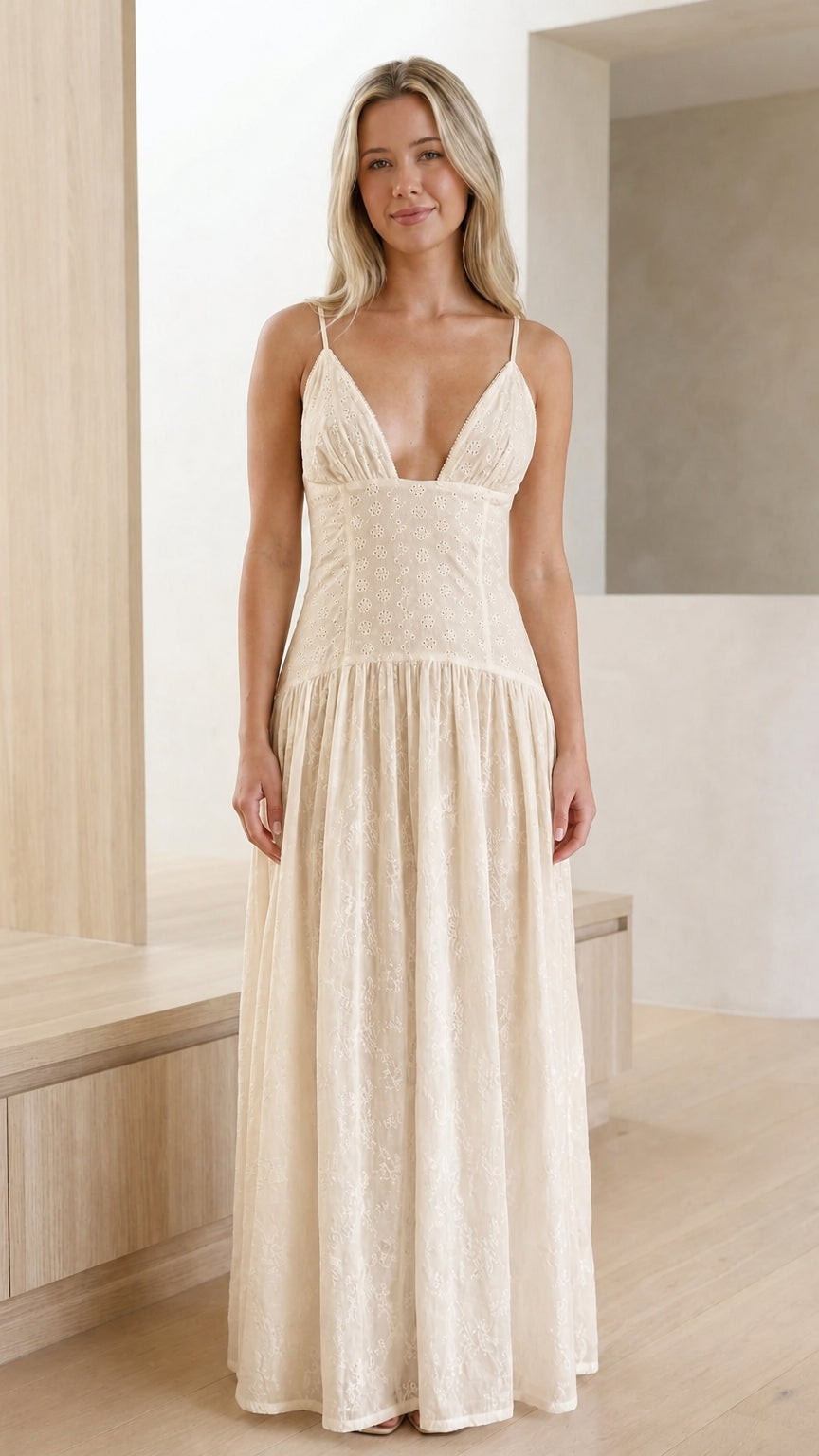 Model wearing champagne cream drop-waist plunge maxi dress