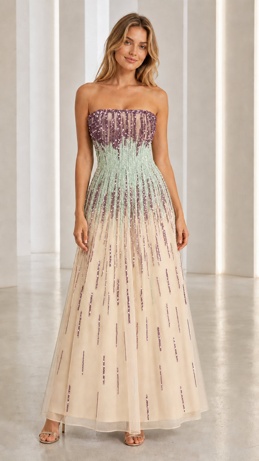 Model wearing champagne sequin strapless evening gown